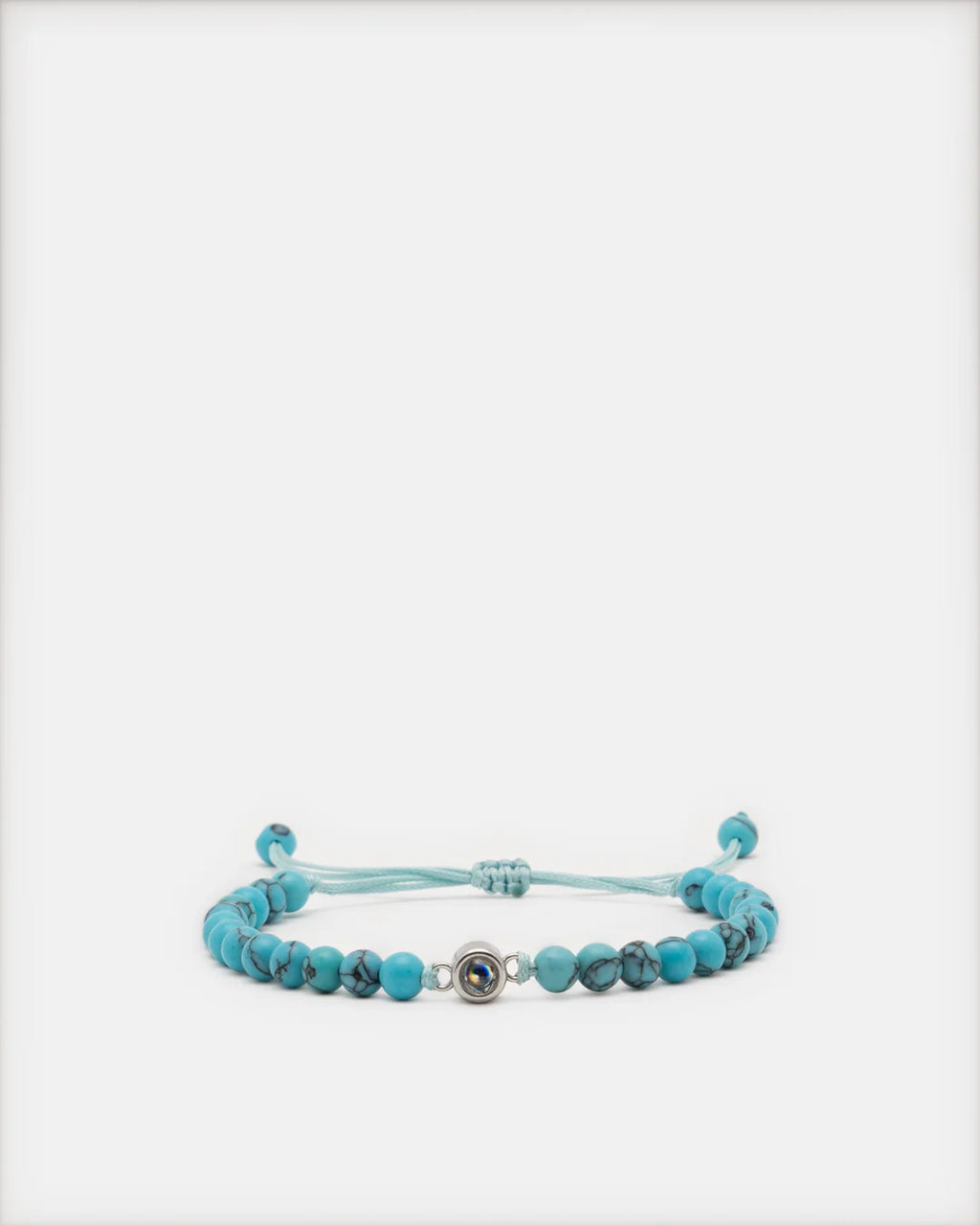 Bracelet pierre naturelle Céleste turquoise avec perle projection photo et cordon réglable