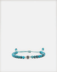 Bracelet pierre naturelle Céleste turquoise avec perle projection photo et cordon réglable